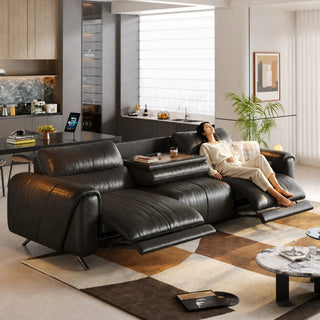 Black leather power recliner sofa in a living room