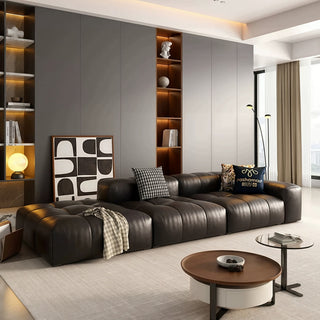 Black leather modular sofa in a living room