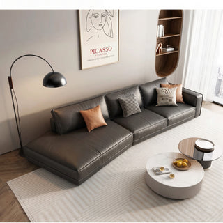 Dark-brown leather sofa with an angled chaise end in a living room