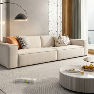 Cream cat-scratch fabric block sofa in a living room