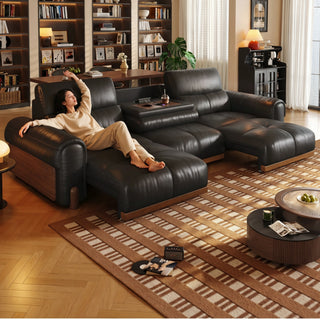 Dark brown leather power sofa bed in a living room