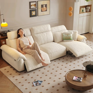 Cream chenille power recliner sofa in a living room