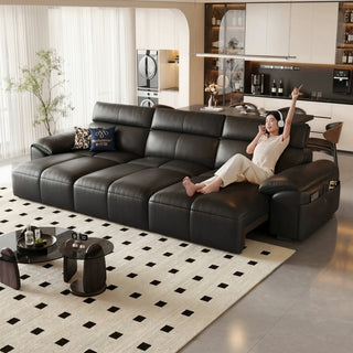 Black leather power sofa bed in a living room