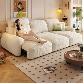 Cream chenille power sofa bed in a living room