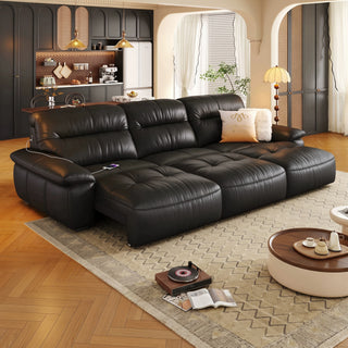 Black leather power reclining sofa in a living room