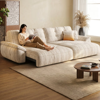 Striped fabric power sofa bed in a living room