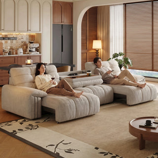 Grey chenille power sofa bed in a living room