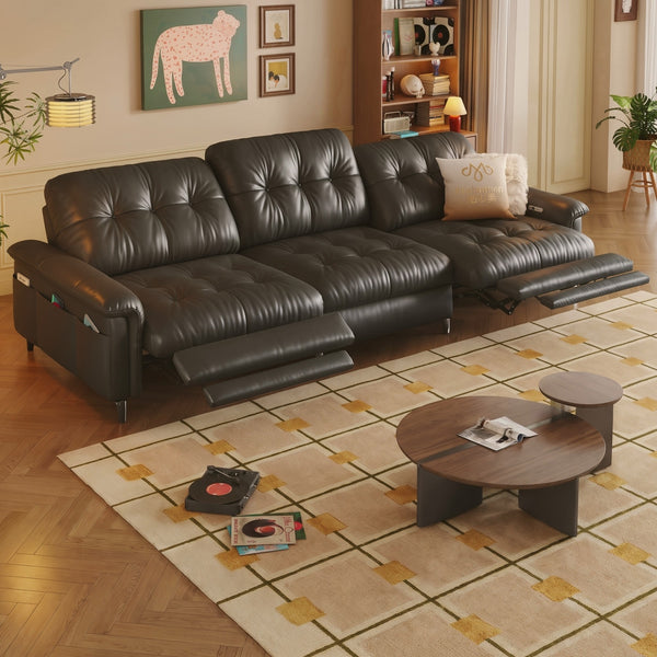 Black leather power recliner sofa in a living room