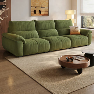 Green fabric sofa in a living room