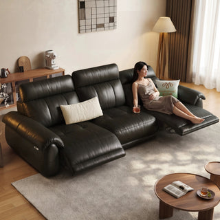 Dark brown leather power recliner sofa in a living room