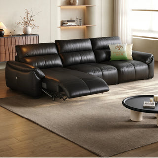 Black leather power recliner sofa in a living room