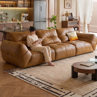 Tan oil-wax leather sofa in a living room