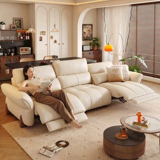 Cream leather power recliner sofa in a living room