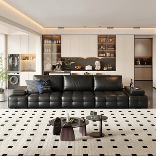 Black leather power sofa bed in a living room