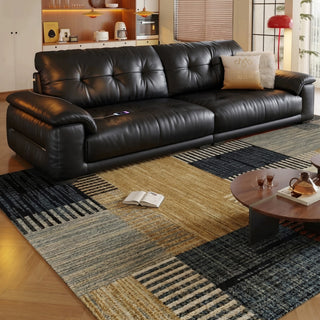 Black leather sofa in a living room