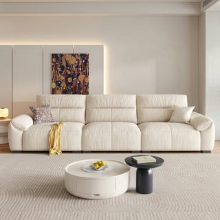Cream cat-scratch fabric piano-key sofa in a living room