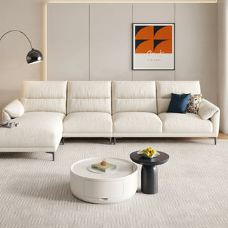 Cream cat-scratch fabric chaise sofa in a living room