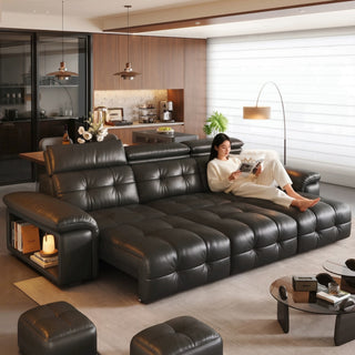 Black leather power sofa bed in a living room