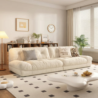 Cream cat-scratch fabric cloud sofa in a living room