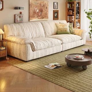 Cream striped chenille sofa in a living room