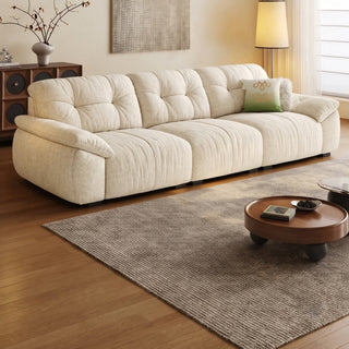 Cream cat-scratch velvet sofa in a living room
