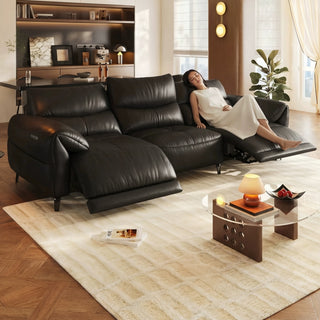Black leather power recliner sofa in a living room