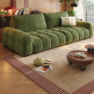 Moss-green ripple chenille sofa in a living room