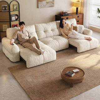 Cream cat-scratch velvet power sofa bed in a living room