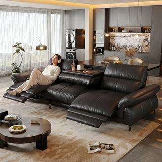 Black leather power recliner sofa in a living room
