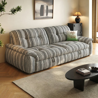 Striped chenille sofa bed in a living room