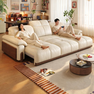 Cream leather power sofa bed with rubberwood side panels