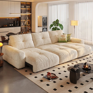 Cream velvet power sofa bed in a living room