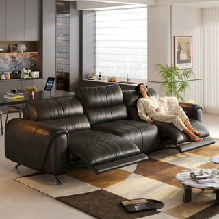 Black leather power recliner sofa in a living room
