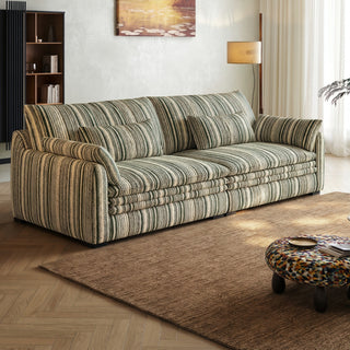 Green striped chenille sofa in a living room