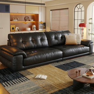 Black leather sofa in a living room