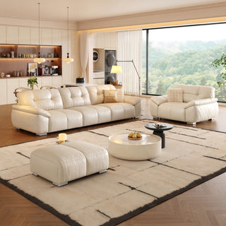 Cream leather power sofa bed in a living room