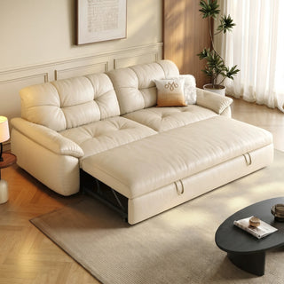 Cream leather-look sofa bed in a living room