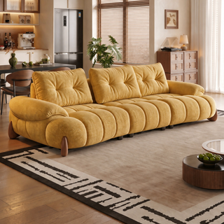 Yellow curved fabric sofa in a living room