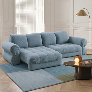 Blue fabric sofa bed in a living room