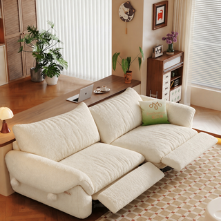 Cream fabric power sofa in a living room
