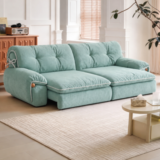 Green fabric sofa bed in a living room