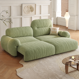 Green fabric sofa bed in a living room