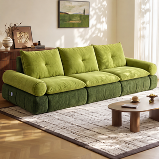 Green fabric sofa bed in a living room
