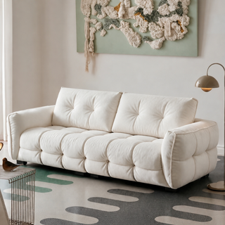 Cream boucle chenille sofa in a living room
