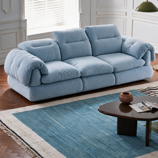 Light blue fabric sofa in a living room