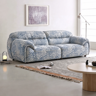 Blue textured chenille sofa in a living room