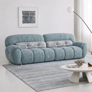 Blue boucle sofa in a living room