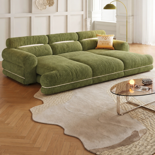 Green chenille power sofa bed in a living room