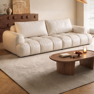 Cream leather puff sofa in a living room