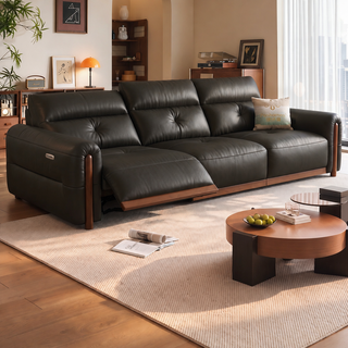 Leather power recliner sofa in a living room